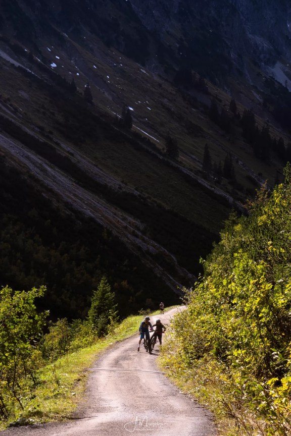 Cyclers attempting to cycle up the hike to lake Seealpsee
