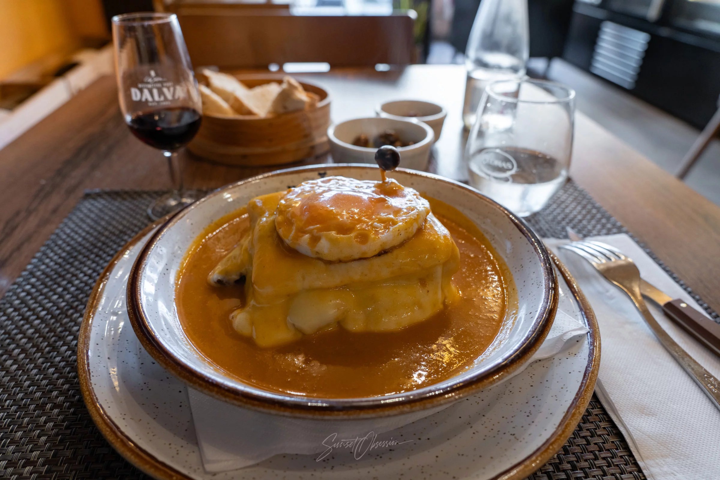 An iconic Porto dish of Francesinha served in a restaurant