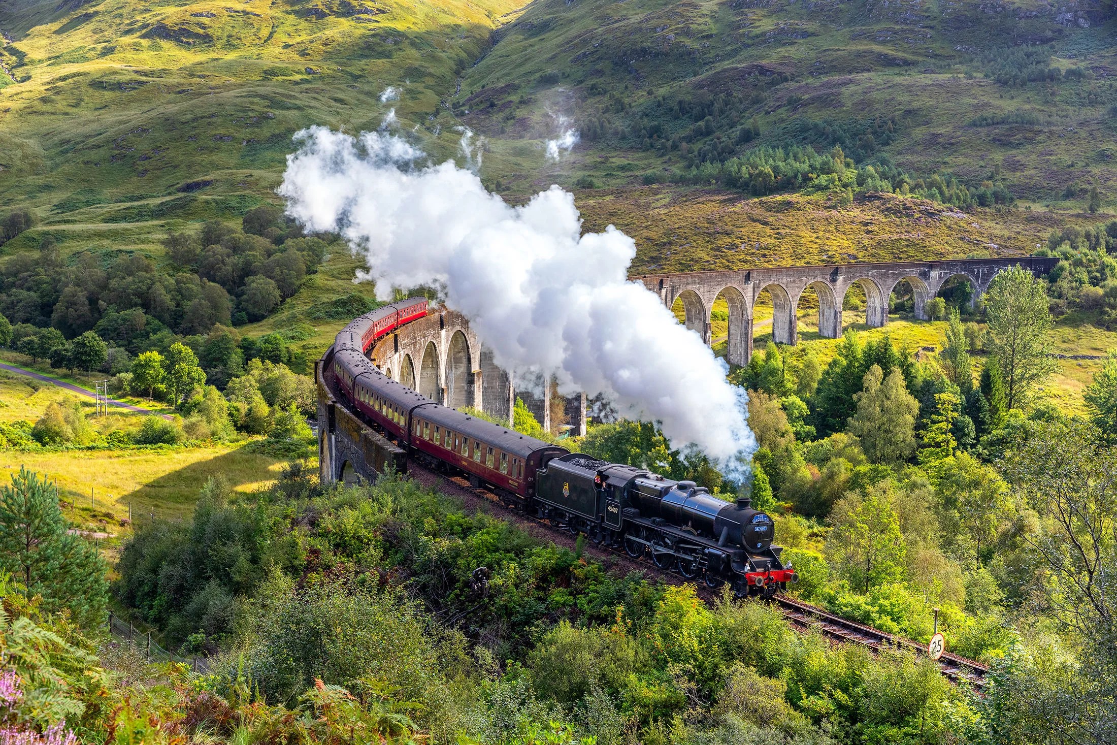 Steam train crossing the Glenfinnan Viaduct is a popular composition in Scotland photography