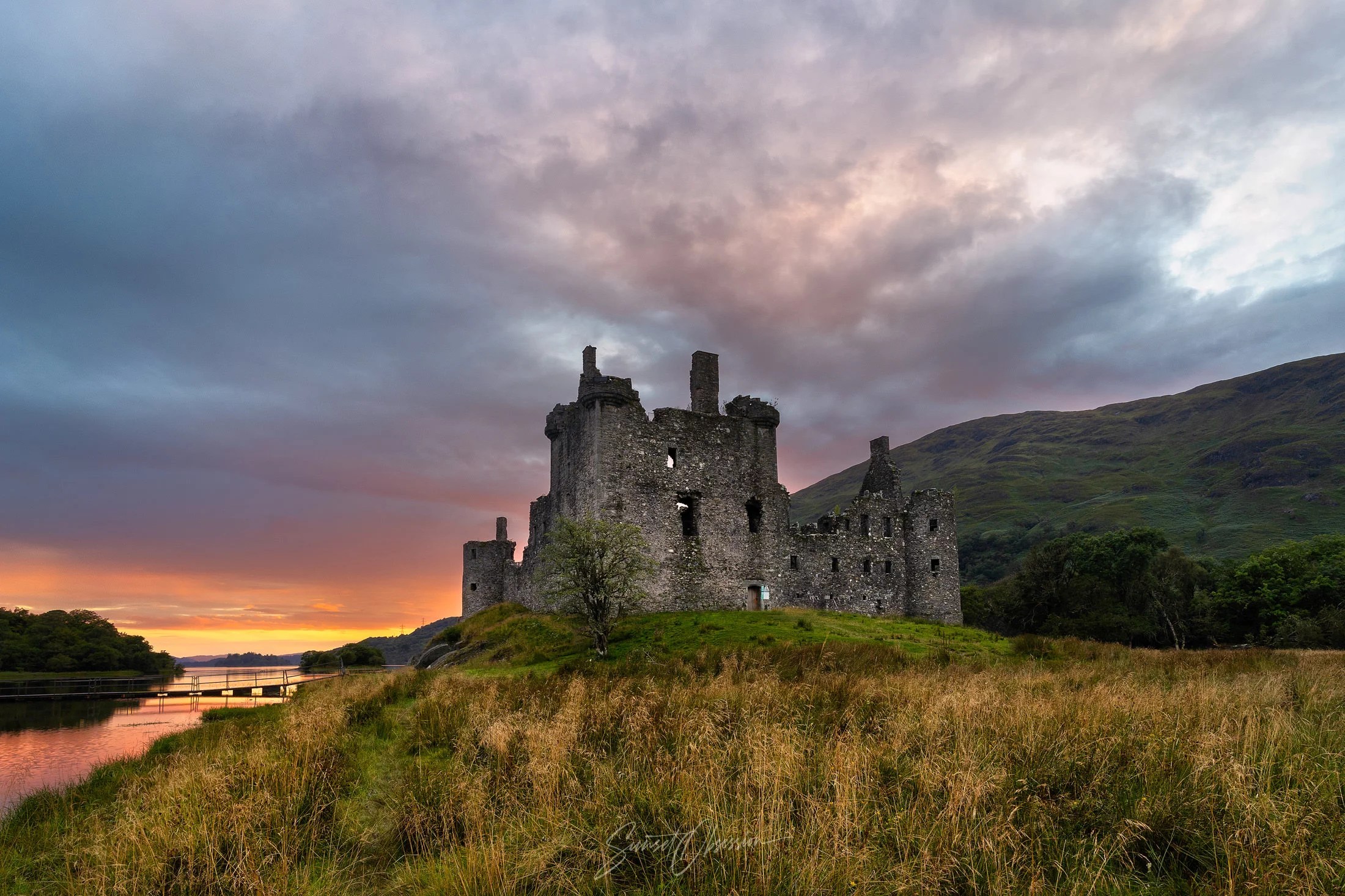 The Kilchurn castle in Scotland during sunset