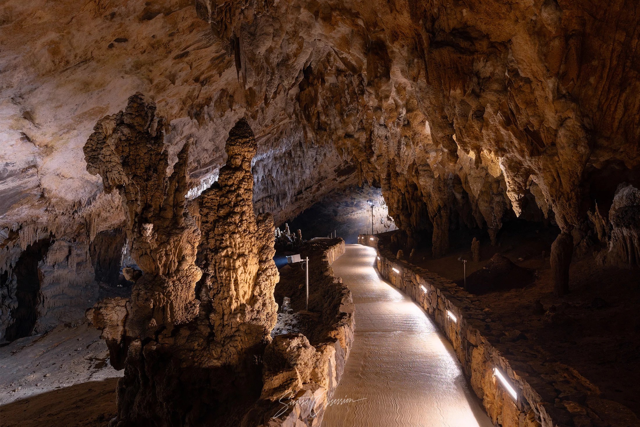 Stalagmites growing right next to the path – please don't touch them though!