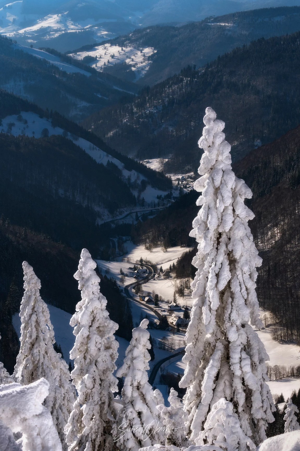 Sunlit valley in the Black Forest in winter, southern Germany